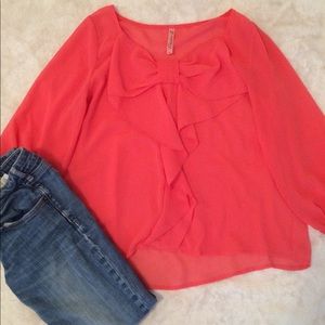 Sheer, coral blouse with bow and peasant sleeves